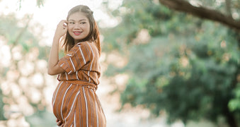 Pregnant woman touching face