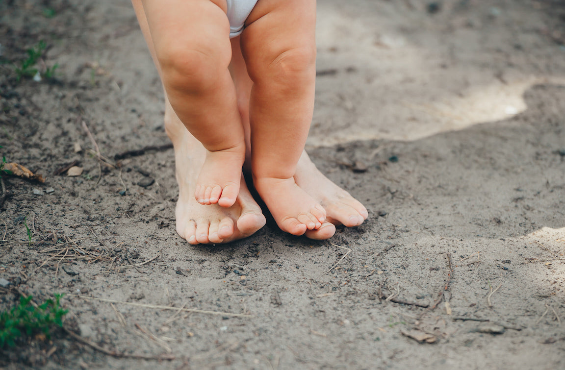 Baby earthing with mother
