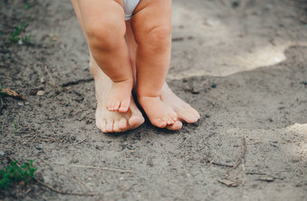 Baby earthing with mother